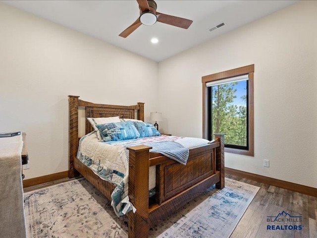 11311 Overlook Ct, Lead, SD 57754 - bedroom with baseboards, wood finished floors, recessed lighting, and ceiling fan