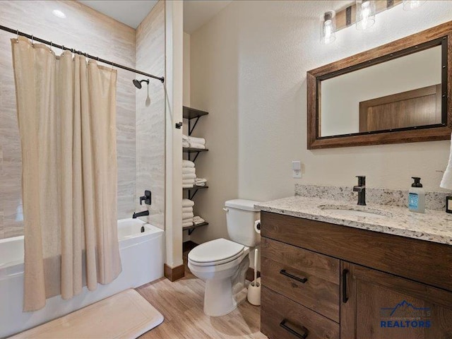 11311 Overlook Ct, Lead, SD 57754 - full bathroom featuring vanity, wood finished floors, shower / bath combo, and toilet