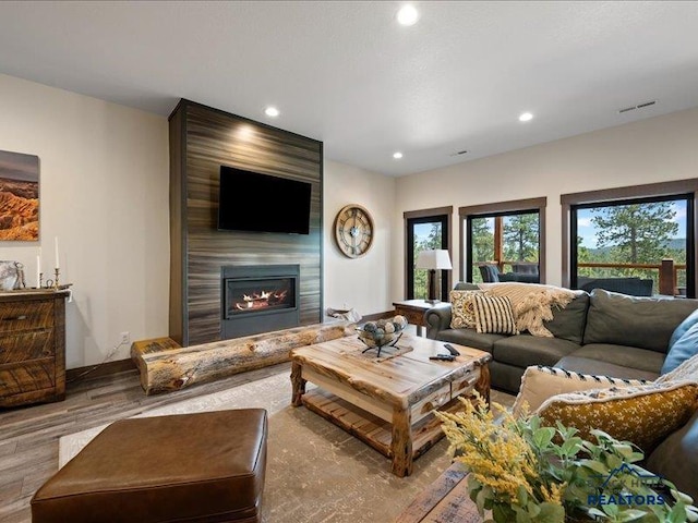 11311 Overlook Ct, Lead, SD 57754 - living area with wood finished floors, recessed lighting, and a fireplace