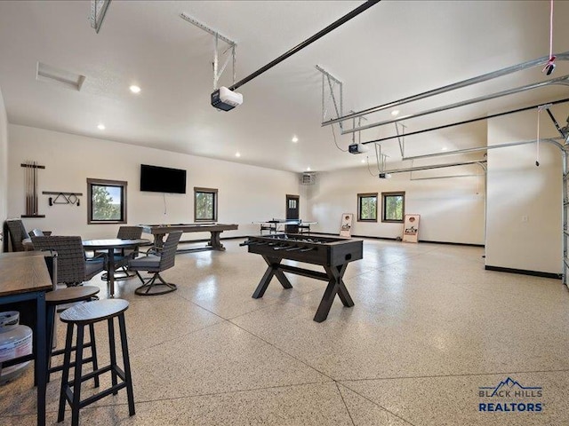 11311 Overlook Ct, Lead, SD 57754 - game room with speckled floor, a garage, recessed lighting, and baseboards