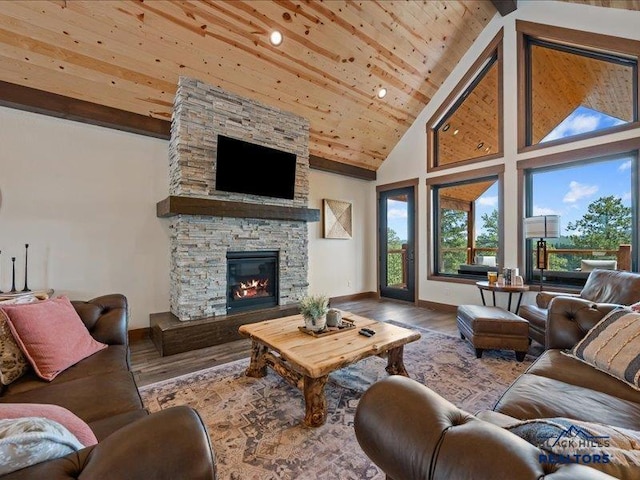 11311 Overlook Ct, Lead, SD 57754 - living room with baseboards, wood finished floors, plenty of natural light, high vaulted ceiling, and wood ceiling