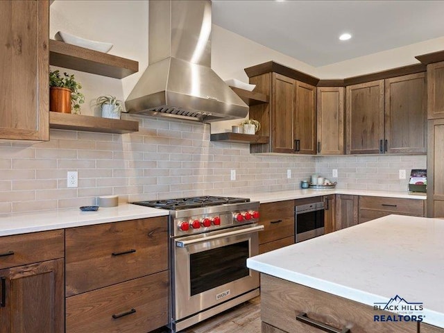 11311 Overlook Ct, Lead, SD 57754 - kitchen featuring open shelves, stainless steel appliances, extractor fan, light countertops, and backsplash