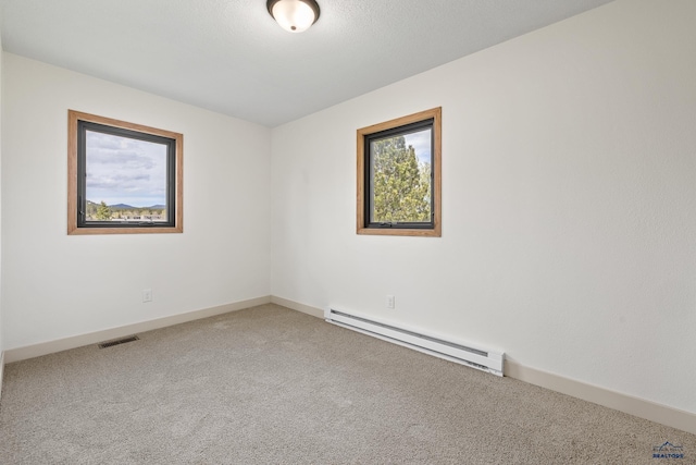 248 S 10th St, Custer, SD 57730 - carpeted empty room with baseboard heating and baseboards