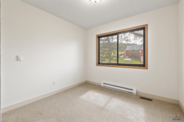 248 S 10th St, Custer, SD 57730 - spare room with a baseboard radiator, carpet floors, and baseboards