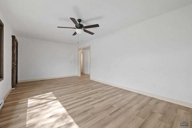 248 S 10th St, Custer, SD 57730 - spare room with light wood-type flooring, ceiling fan, baseboards, and baseboard heating