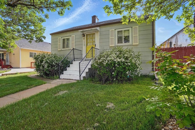 1905 5th St, Rapid City, SD 57701 - bungalow-style home featuring a chimney