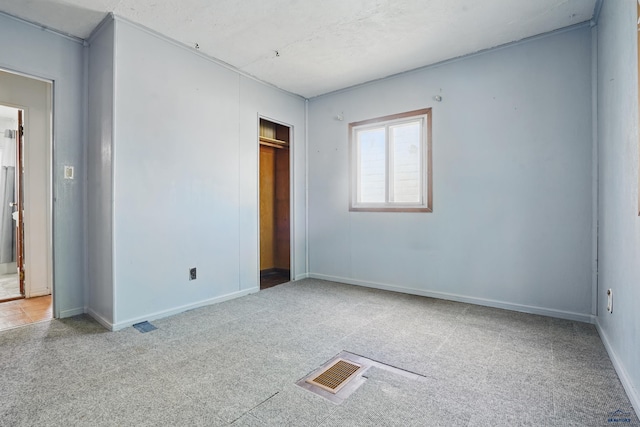 1905 5th St, Rapid City, SD 57701 - unfurnished bedroom with carpet flooring, baseboards, and a closet