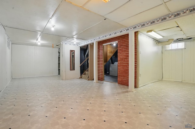 1905 5th St, Rapid City, SD 57701 - below grade area featuring washer / clothes dryer, stairs, and tile patterned floors