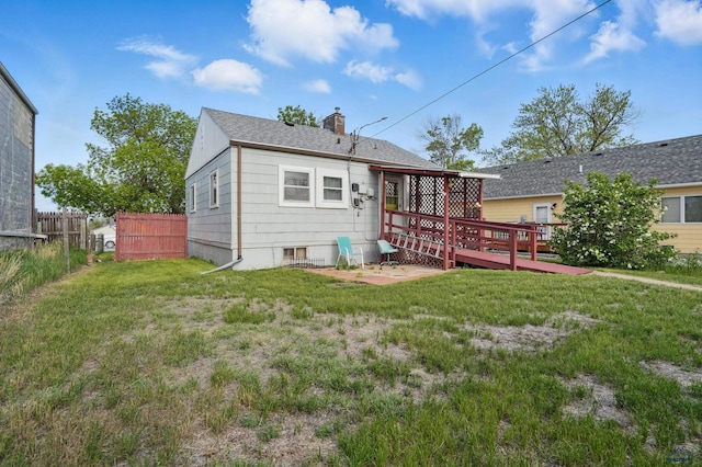 1905 5th St, Rapid City, SD 57701 - back of house featuring a deck and a chimney