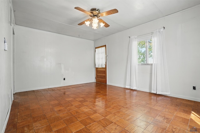1905 5th St, Rapid City, SD 57701 - spare room featuring a ceiling fan and baseboards