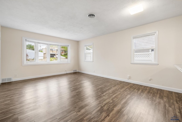 814 Flormann, Rapid City, SD 57701 - spare room featuring dark wood-style flooring and baseboards