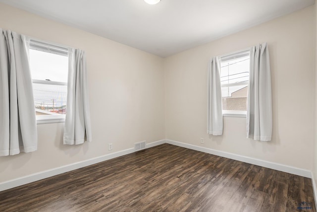 814 Flormann, Rapid City, SD 57701 - spare room featuring dark wood finished floors and baseboards