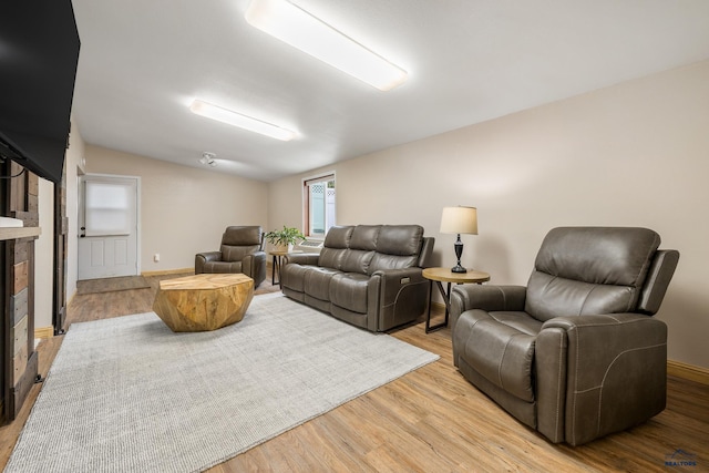 814 Flormann, Rapid City, SD 57701 - living room with light wood-type flooring, lofted ceiling, and baseboards