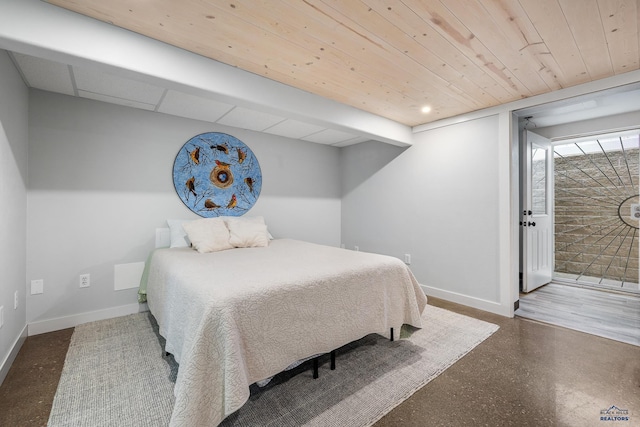 814 Flormann, Rapid City, SD 57701 - bedroom featuring baseboards, access to exterior, and wood ceiling