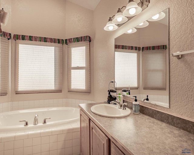 7410 Pinewood Ct, Rapid City, SD 57702 - full bathroom with a textured wall, vanity, and a garden tub