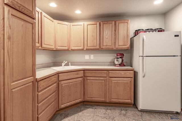 7410 Pinewood Ct, Rapid City, SD 57702 - kitchen with freestanding refrigerator, a sink, light countertops, light brown cabinetry, and recessed lighting