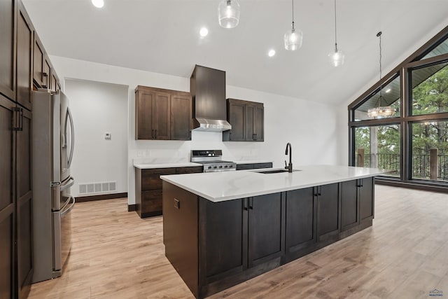 12290 Prairie View Loop, Whitewood, SD 57793 - kitchen featuring stainless steel appliances, high vaulted ceiling, a sink, wall chimney range hood, and light wood finished floors