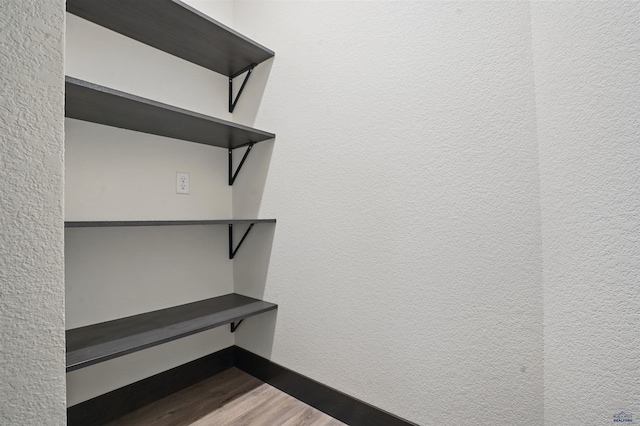12290 Prairie View Loop, Whitewood, SD 57793 - walk in closet featuring wood finished floors