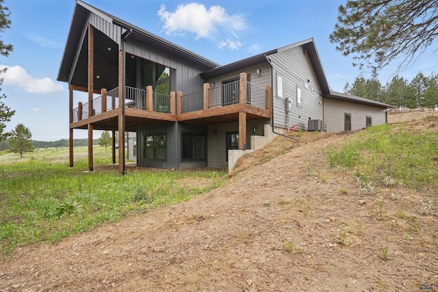 12290 Prairie View Loop, Whitewood, SD 57793 - back of property featuring central AC and a wooden deck