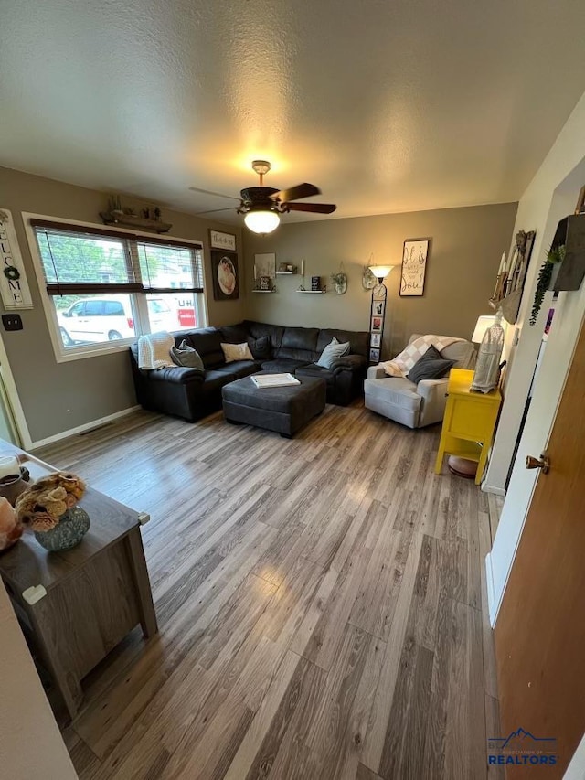 2104 Colorado, Sturgis, SD 57785 - living room with wood finished floors, ceiling fan, and baseboards