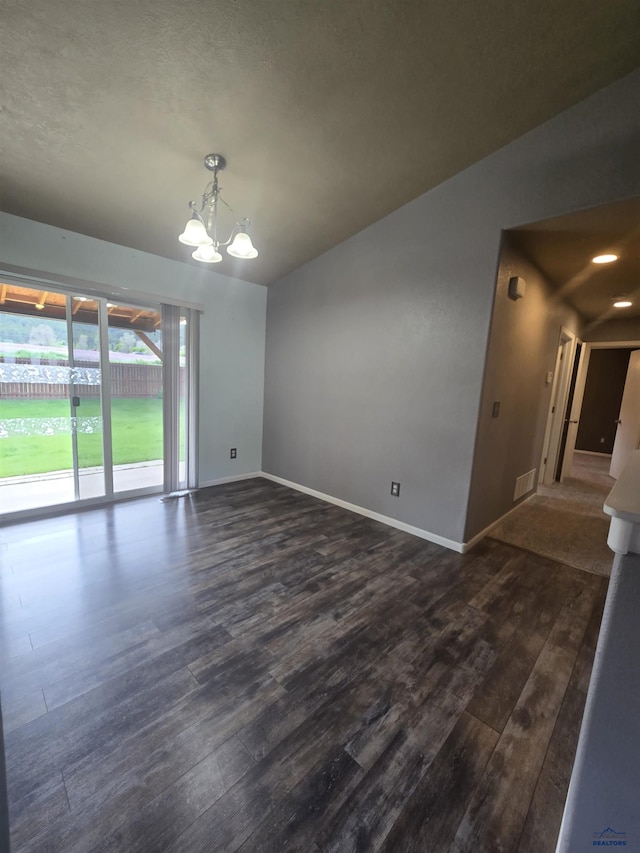 14655 Telluride St, Summerset, SD 57769 - empty room featuring a chandelier, baseboards, and dark wood-type flooring