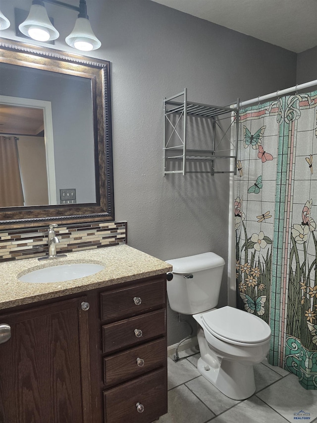 14655 Telluride St, Summerset, SD 57769 - full bath with vanity, toilet, tile patterned floors, and a shower with curtain