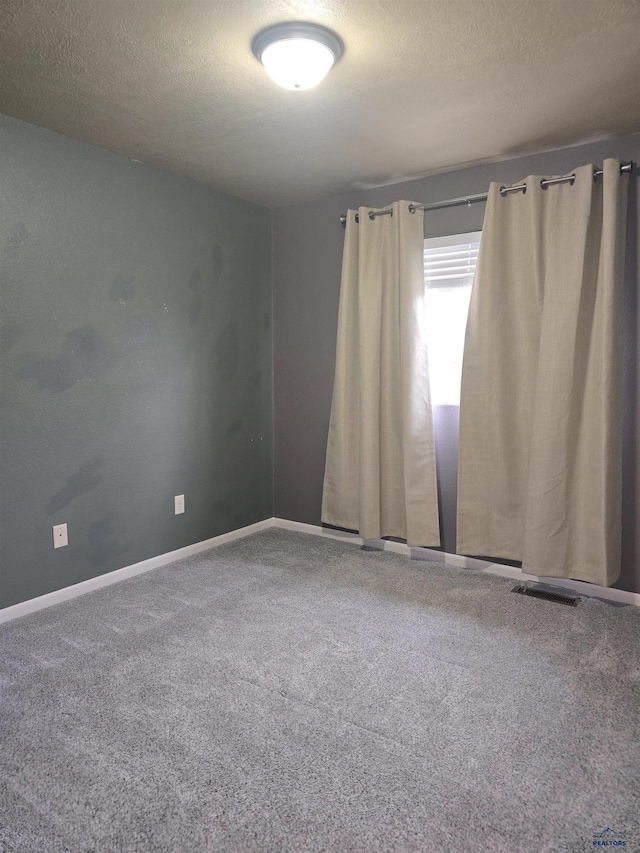 14655 Telluride St, Summerset, SD 57769 - carpeted spare room with a textured ceiling and baseboards