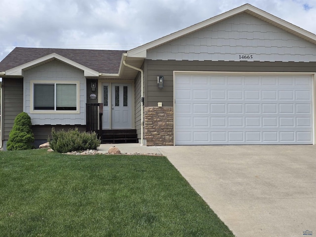 14655 Telluride St, Summerset, SD 57769 - single story home with concrete driveway, a front yard, an attached garage, a shingled roof, and stone siding