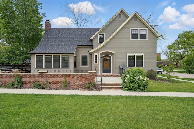 902 Fulton St, Rapid City, SD 57701 - view of front of home with a chimney and a shingled roof