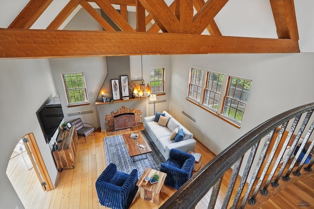 902 Fulton St, Rapid City, SD 57701 - living area with high vaulted ceiling, a chandelier, beam ceiling, and hardwood / wood-style flooring