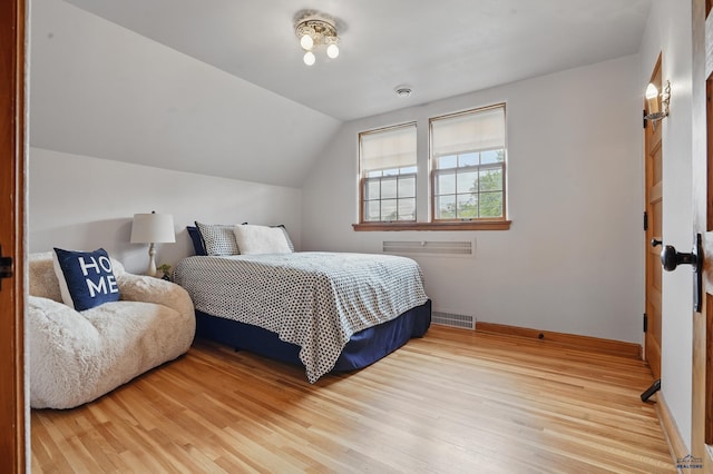 902 Fulton St, Rapid City, SD 57701 - bedroom featuring light wood finished floors, baseboards, and lofted ceiling