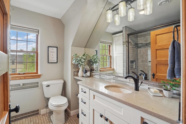 902 Fulton St, Rapid City, SD 57701 - full bath with toilet, a stall shower, vanity, tile patterned flooring, and backsplash