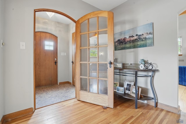 902 Fulton St, Rapid City, SD 57701 - entrance foyer featuring wood finished floors, baseboards, and arched walkways