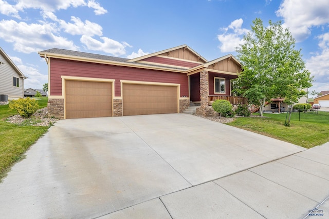 3216 Eunice Dr, Rapid City, SD 57703 - craftsman inspired home featuring board and batten siding, stone siding, a garage, a front yard, and concrete driveway