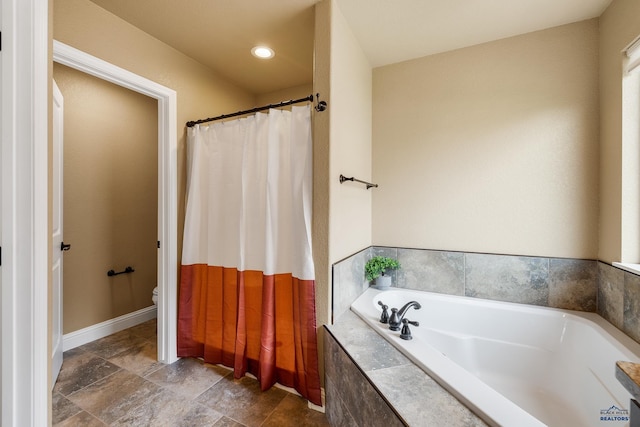 3216 Eunice Dr, Rapid City, SD 57703 - full bathroom featuring a bath, toilet, and stone finish flooring