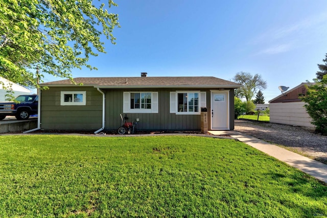 426 E Oakland, Rapid City, SD 57701 - rear view of property featuring a lawn and board and batten siding