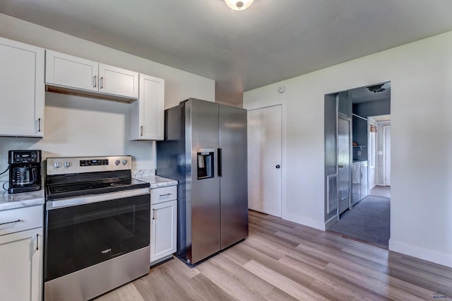 426 E Oakland, Rapid City, SD 57701 - kitchen featuring stainless steel appliances, light wood-style flooring, white cabinets, baseboards, and light stone counters