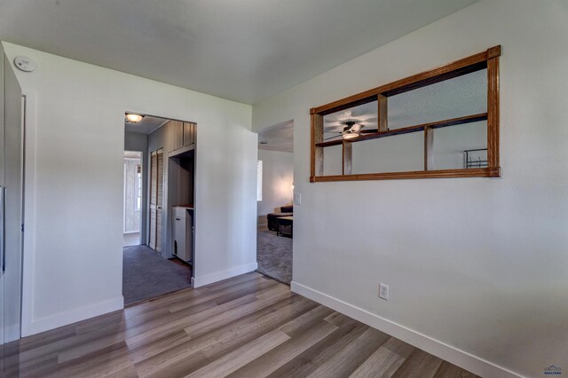 426 E Oakland, Rapid City, SD 57701 - unfurnished room with wood finished floors, a smoke detector, baseboards, and ceiling fan