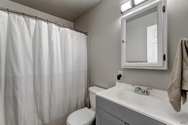 426 E Oakland, Rapid City, SD 57701 - full bathroom with toilet, vanity, and a shower with shower curtain
