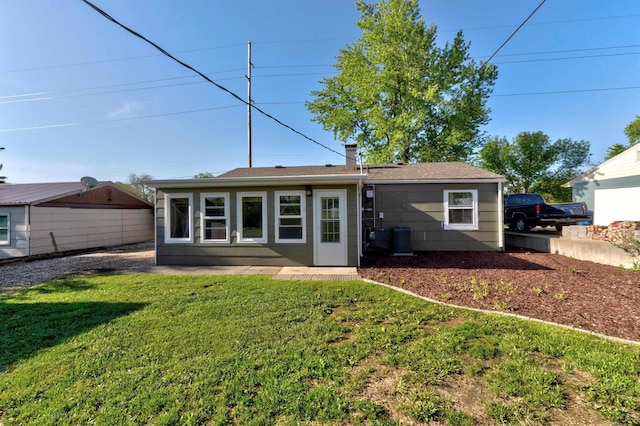 426 E Oakland, Rapid City, SD 57701 - back of property with a yard, a chimney, and a patio
