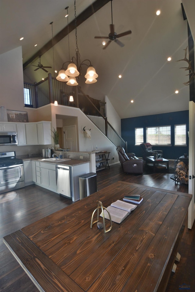14450 Edgewood Pl, Piedmont, SD 57769 - dining room with a ceiling fan, high vaulted ceiling, dark wood-type flooring, stairs, and recessed lighting
