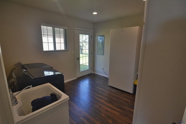 14450 Edgewood Pl, Piedmont, SD 57769 - laundry area featuring washer and clothes dryer, electric panel, dark wood finished floors, baseboards, and recessed lighting