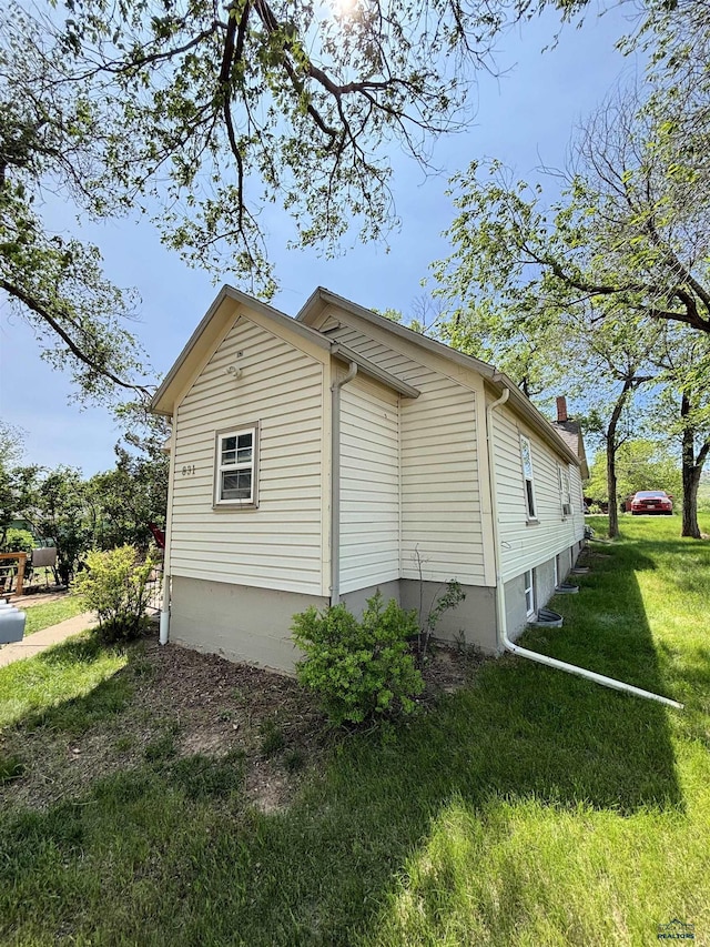 831 Dilger Ave, Rapid City, SD 57701 - view of home's exterior featuring a yard