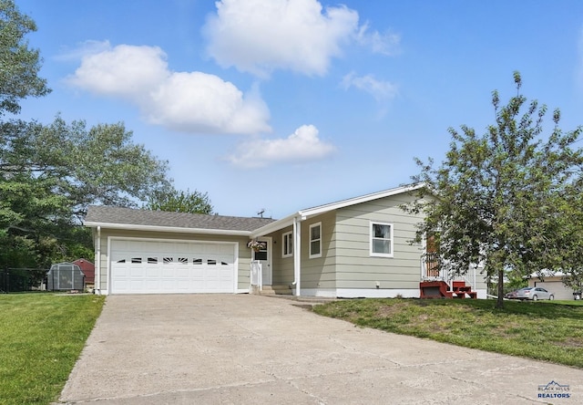 701 Hustead St, Wall, SD 57790 - ranch-style home with driveway, a garage, and a front yard