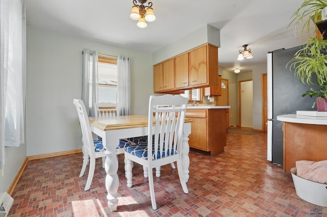 701 Hustead St, Wall, SD 57790 - dining space with baseboards and brick patterned floors