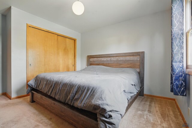 701 Hustead St, Wall, SD 57790 - bedroom featuring carpet flooring, baseboards, and a closet