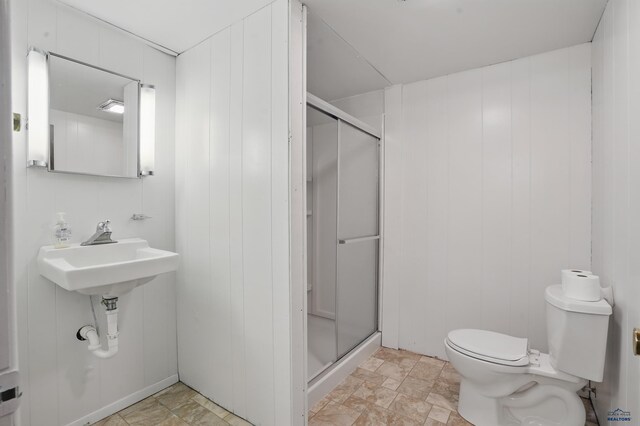 701 Hustead St, Wall, SD 57790 - full bathroom featuring a stall shower, toilet, and a sink