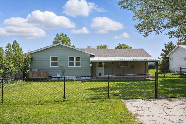 701 Hustead St, Wall, SD 57790 - back of property with roof with shingles and a gate