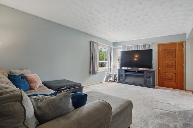 701 Hustead St, Wall, SD 57790 - carpeted living area featuring baseboards and a textured ceiling
