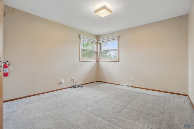 628 Oakland, Rapid City, SD 57701 - spare room featuring carpet and baseboards